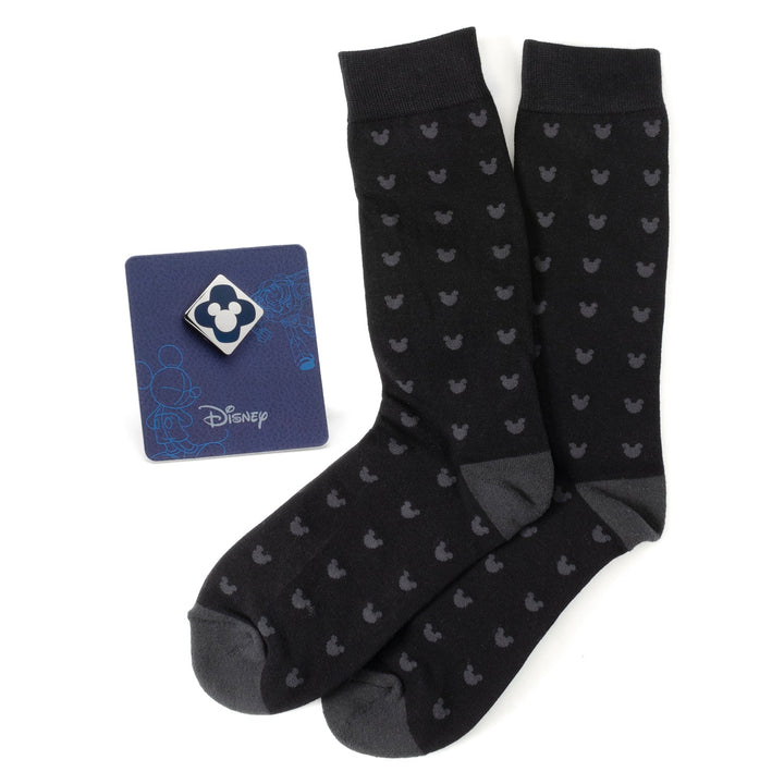 Disney Mickey Mouse Silhouette Motif Black Sock and Mickey Blue Lapel Pin Gift Set featuring black socks with a grey Mickey silhouette pattern and a blue Mickey lapel pin displayed on a Disney card.
