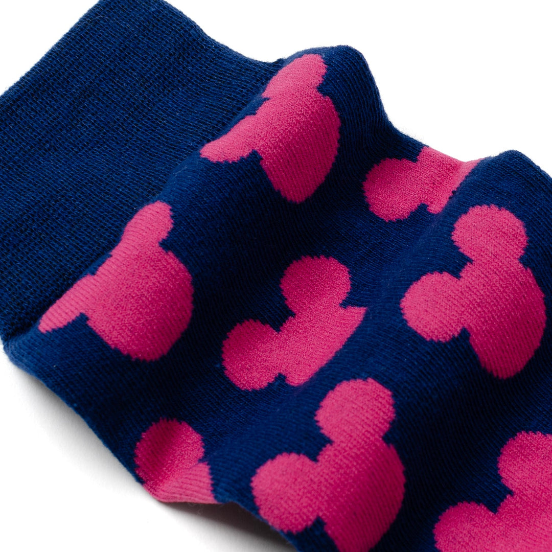Blue socks featuring a repeating pattern of pink Mickey Mouse silhouettes, from the Disney Mickey Mouse Silhouette Pink Sock and Mickey Blue Lapel Pin Gift Set.