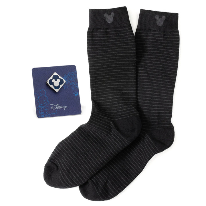 A Disney Mickey Mouse Silhouette Stripe Sock and Mickey Blue Lapel Pin Gift Set featuring black striped Mickey silhouette socks and a matching lapel pin on a display card.