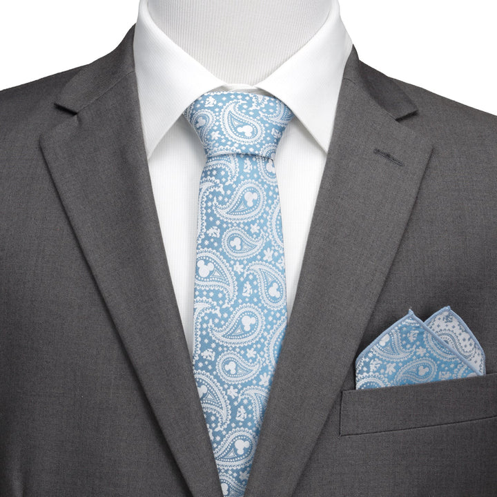 A Disney Mickey Mouse Teal Paisley Men’s Tie and matching pocket square worn with a grey suit and white dress shirt.