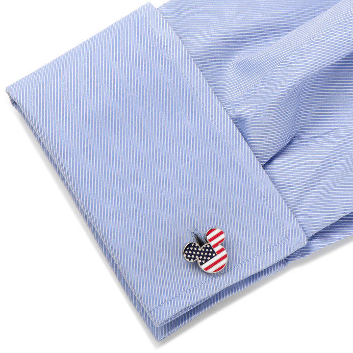 Disney Mickey Mouse Stars and Stripes Cufflinks featuring a Mickey Mouse shape with an American flag pattern, attached to a light blue dress shirt cuff.