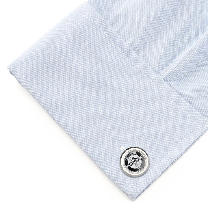 Disney Mickey Mouse Original Cufflinks: a round silver-tone cufflink featuring a vintage Mickey Mouse graphic, attached to a folded light blue dress shirt cuff.