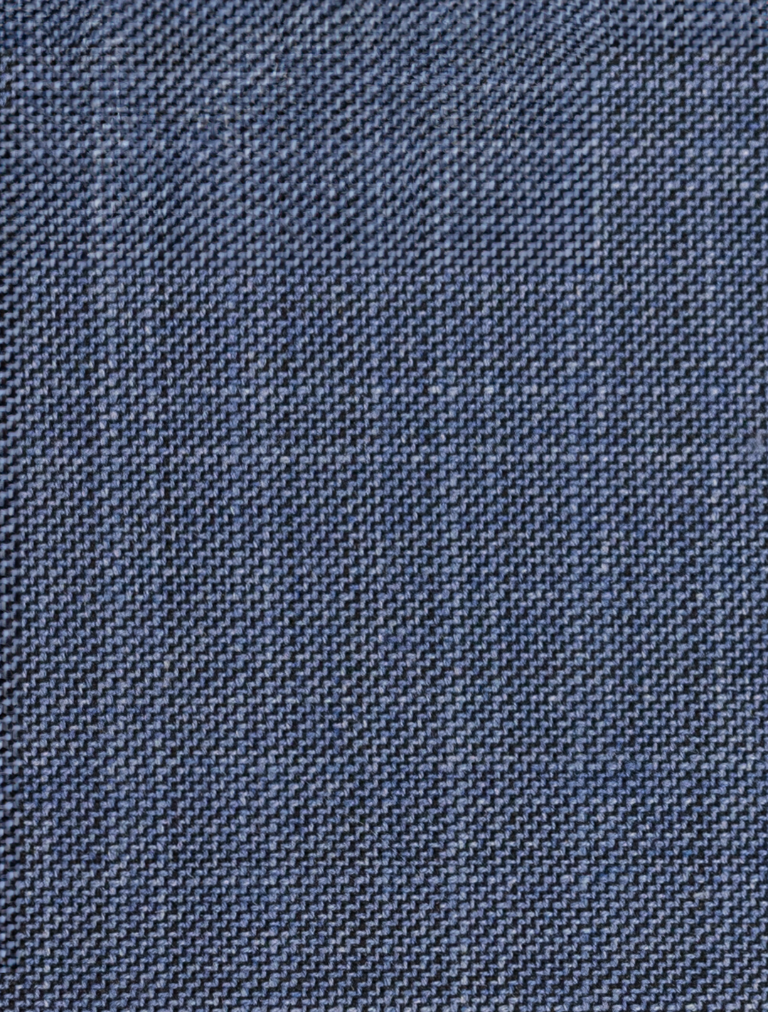 Close-up of FUBU Stone Blue Peak Lapel 2-Piece Suit fabric, its detailed weave pattern reminiscent of the craftsmanship found in modern fit suits from Fubu The Colle.