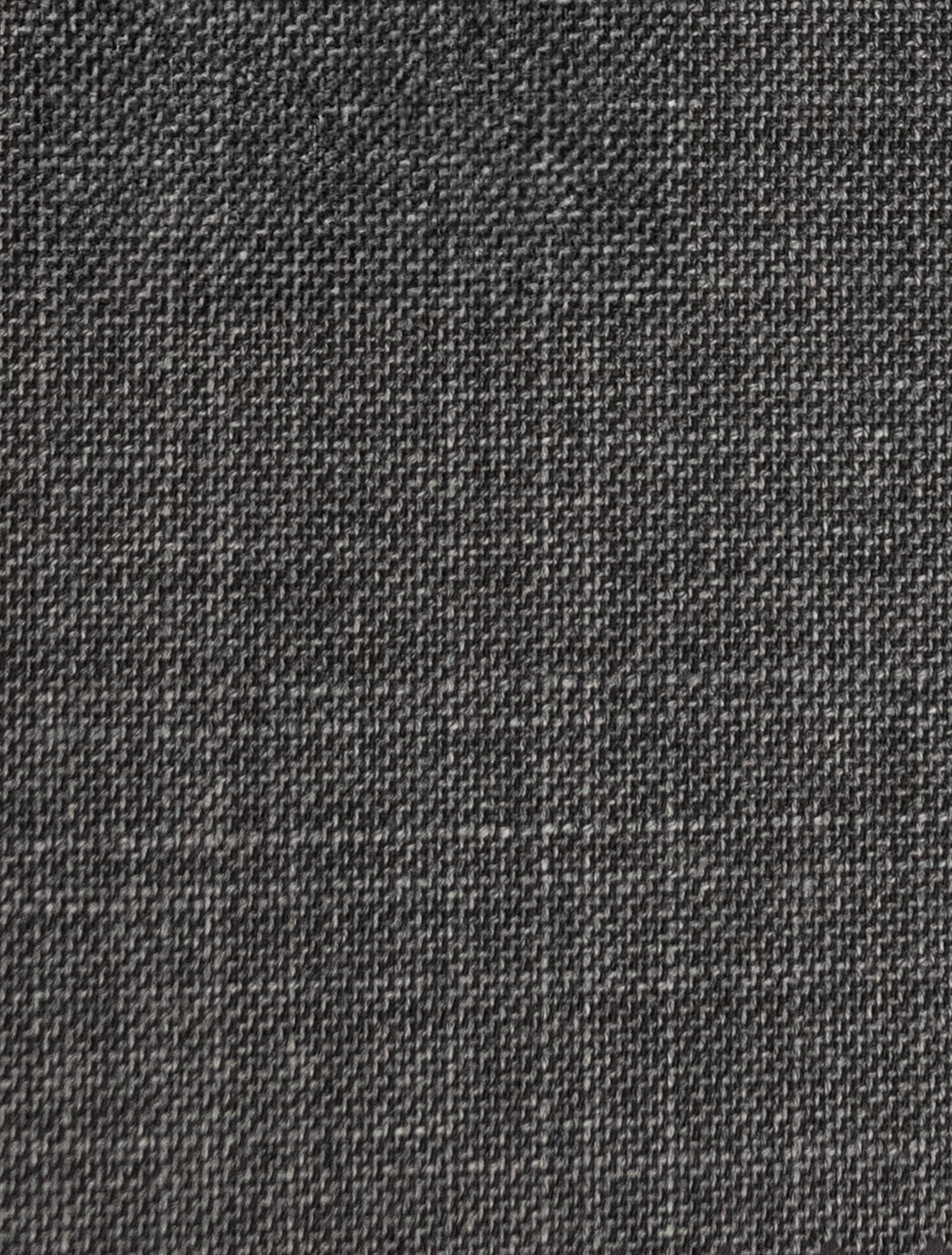 Close-up of FUBU Iron Grey Peak Lapel Suit from Fubu The Colle, showcasing its dark gray woven fabric texture and pattern—ideal for crafting a sleek, slim-fit suit.