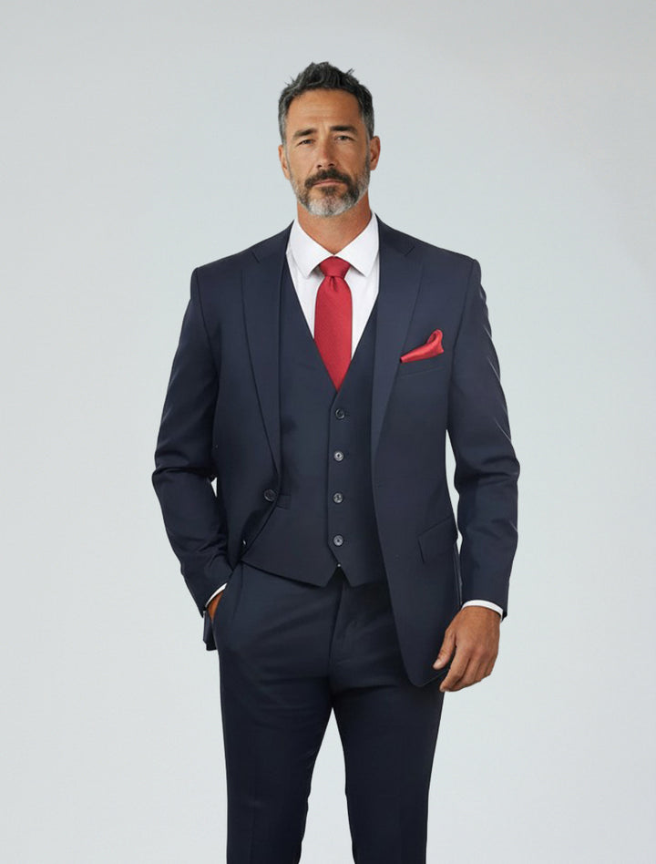 A man with short dark hair and a beard wears the Navy Men&