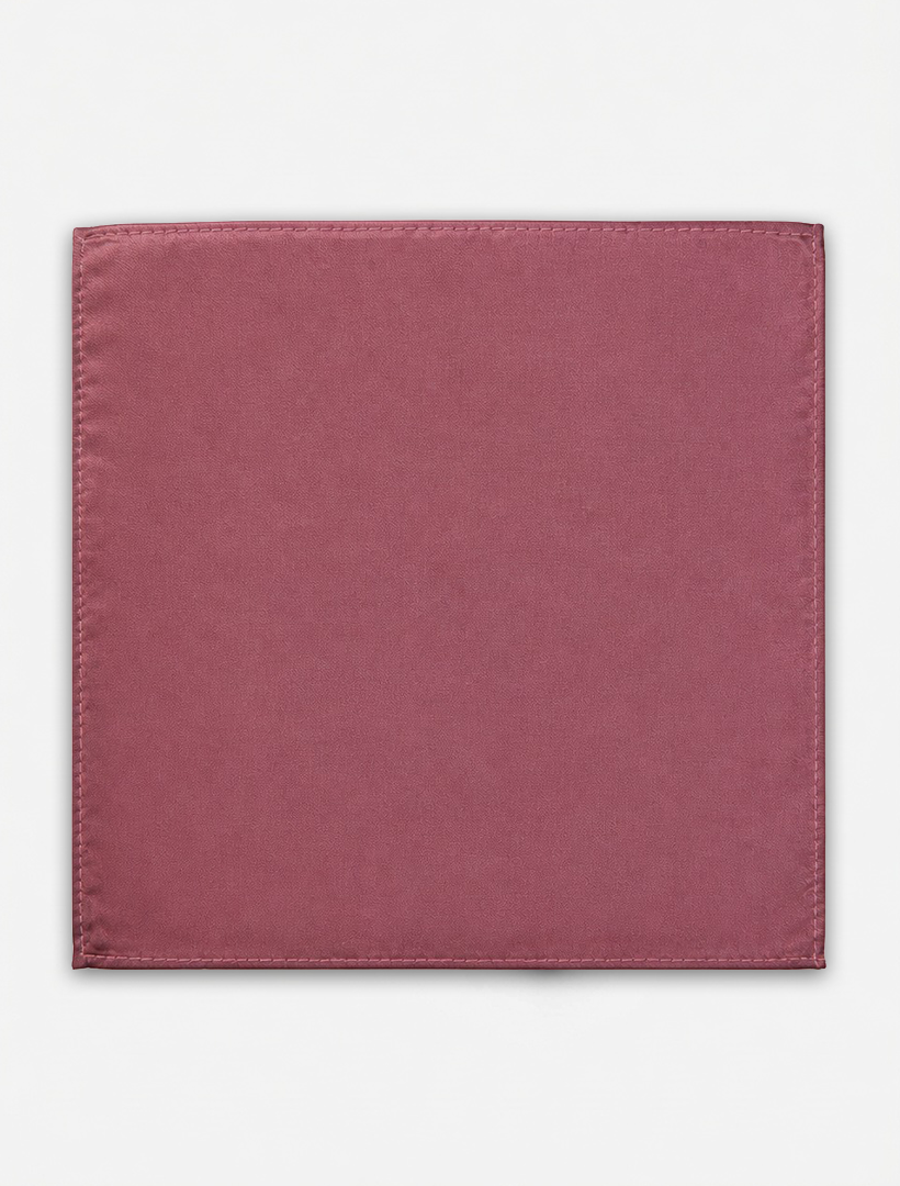 A square Rose Pocket Square Handkerchief by Karako Collecti, crafted from mauve-colored microfiber with visible stitched edges, is laid flat against a plain white background.