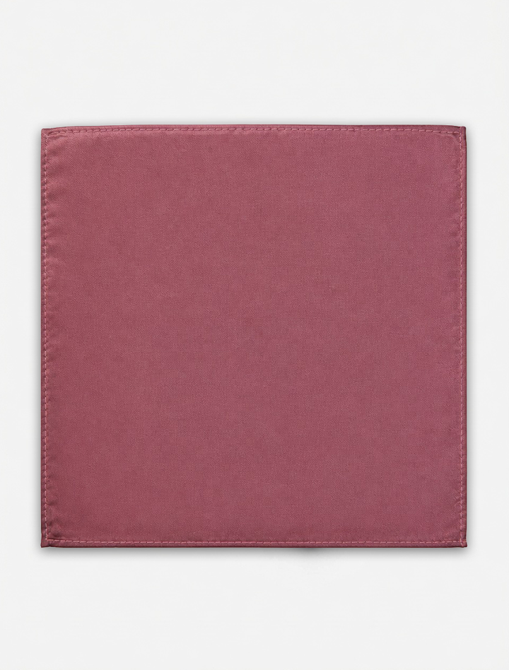 A square Rose Pocket Square Handkerchief by Karako Collecti, crafted from mauve-colored microfiber with visible stitched edges, is laid flat against a plain white background.