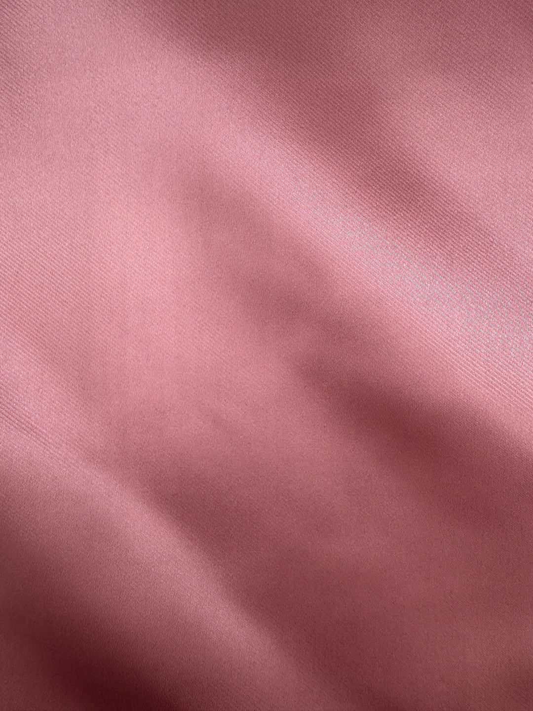 Close-up of the Rose Pocket Square Handkerchief from Karako Collecti, featuring smooth pink fabric with gentle folds and a subtle sheen—an elegant microfiber accessory perfect for formal occasions.