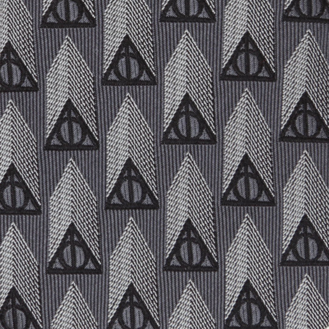 Harry Potter Deathly Hallows Gray Silk Men’s Tie featuring a repeating pattern of black Deathly Hallows symbols and gray vertical geometric shapes.