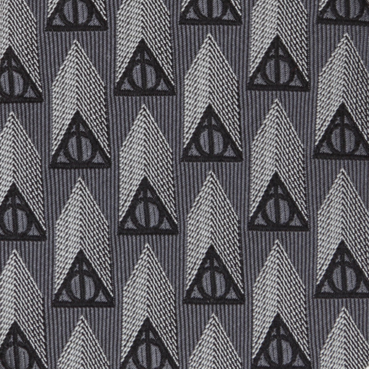 Harry Potter Deathly Hallows Gray Silk Men’s Tie featuring a repeating pattern of black Deathly Hallows symbols and gray vertical geometric shapes.