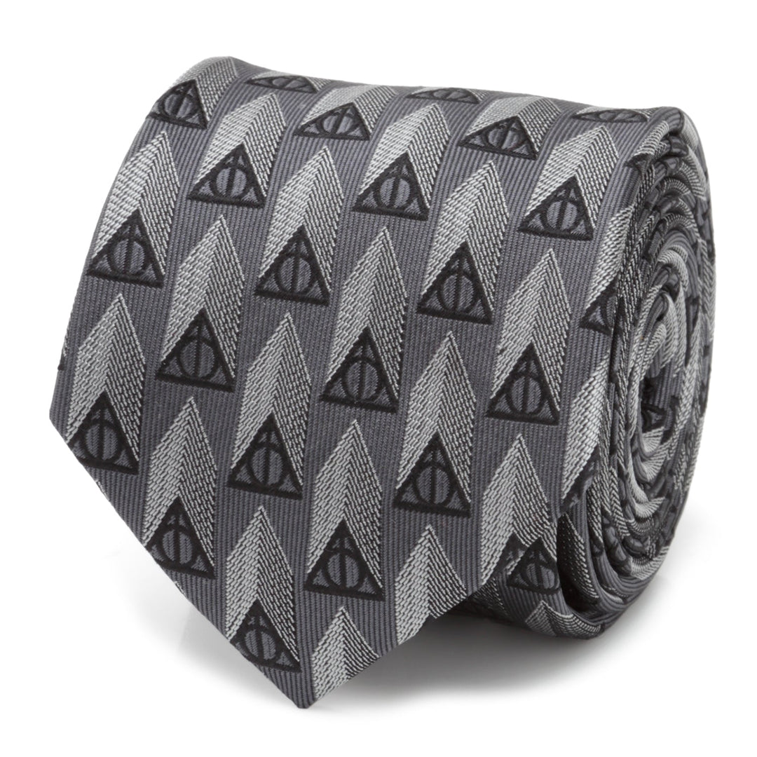 Harry Potter Deathly Hallows Gray Silk Men’s Tie featuring a repeating pattern of black Deathly Hallows symbols over light and dark gray chevron-style stripes.