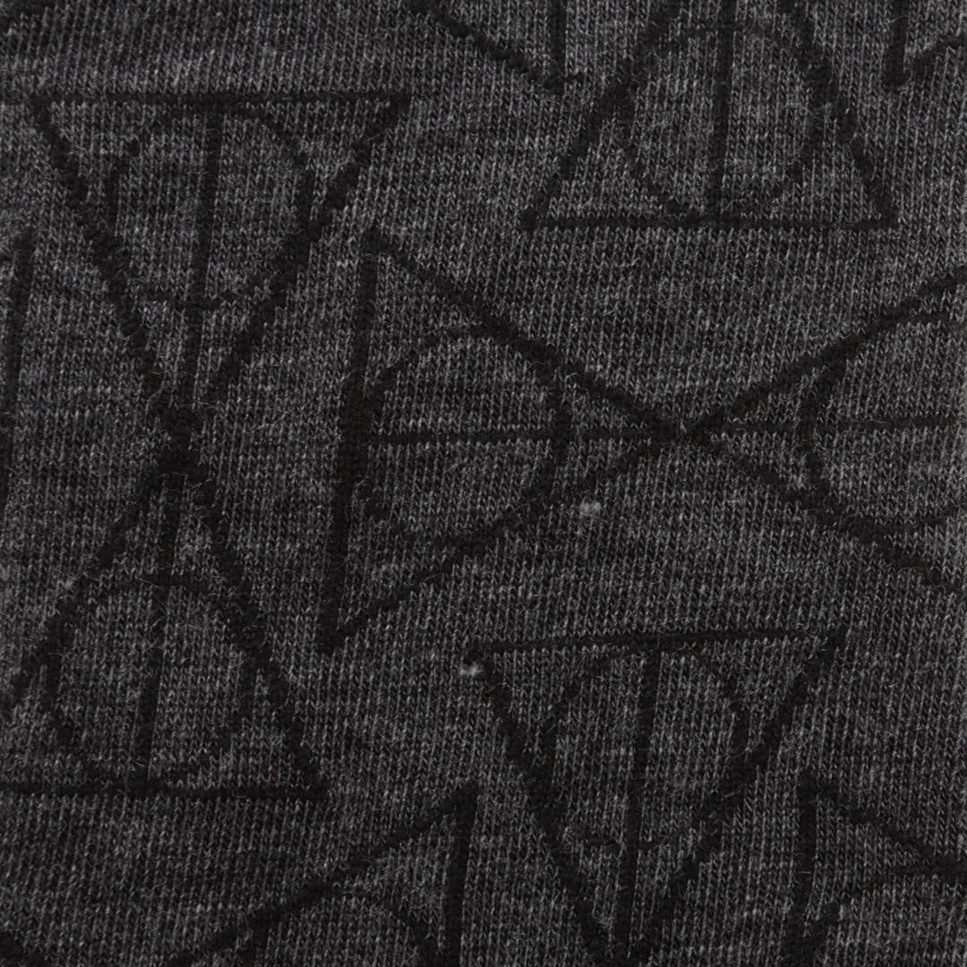 Harry Potter Deathly Hallows Black Men’s Socks are dark gray dress socks featuring a repeating black Deathly Hallows symbol pattern.