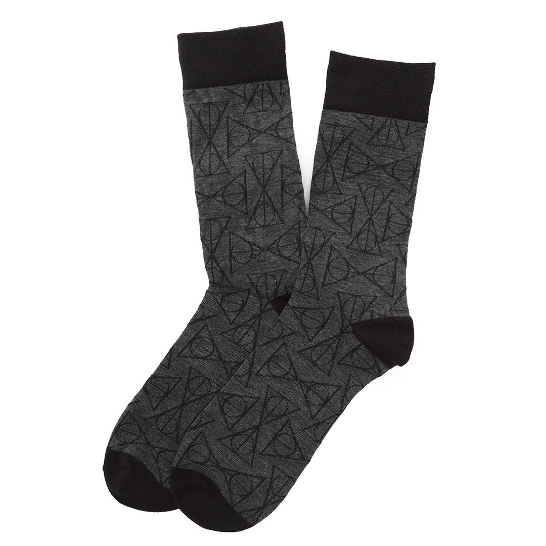 A pair of Harry Potter Deathly Hallows Gray Necktie Gift Set crew socks in gray with a black Deathly Hallows pattern, featuring black cuffs, heels, and toes.
