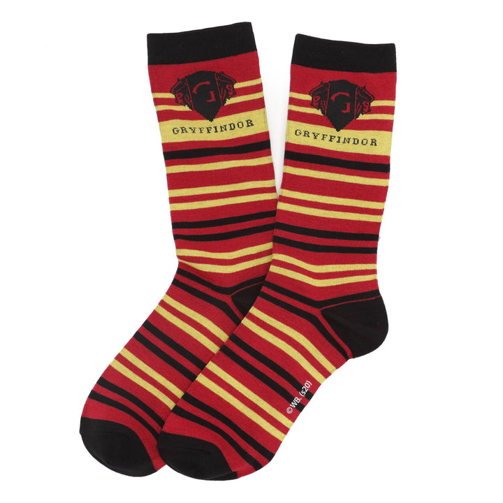 A pair of red, yellow, and black striped Harry Potter Gryffindor Men’s Sock featuring the house lion crest and the text “Gryffindor.”