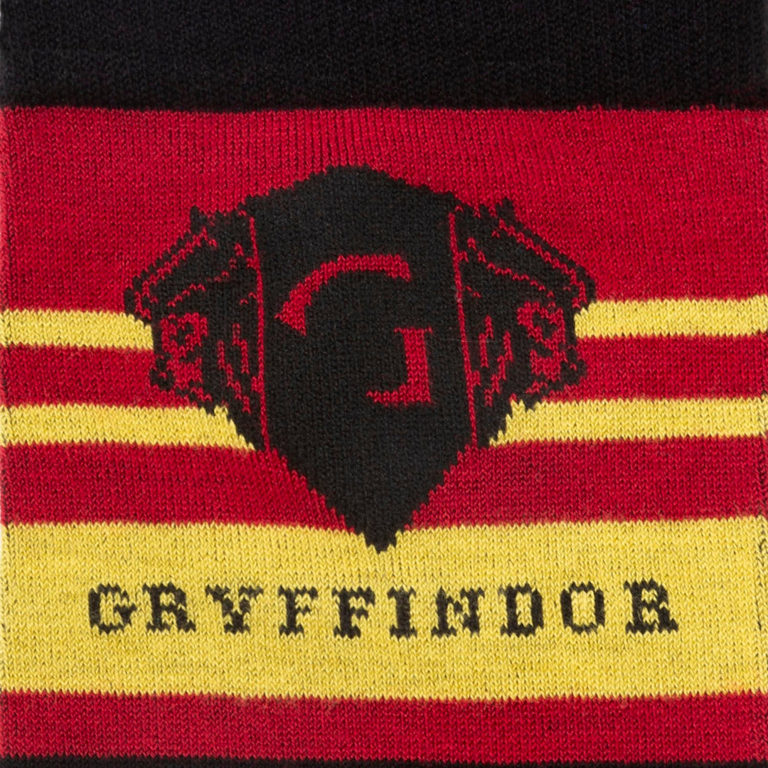Harry Potter Gryffindor Men’s Sock featuring red and yellow stripes, a black lion crest, and the word “GRYFFINDOR” printed below.