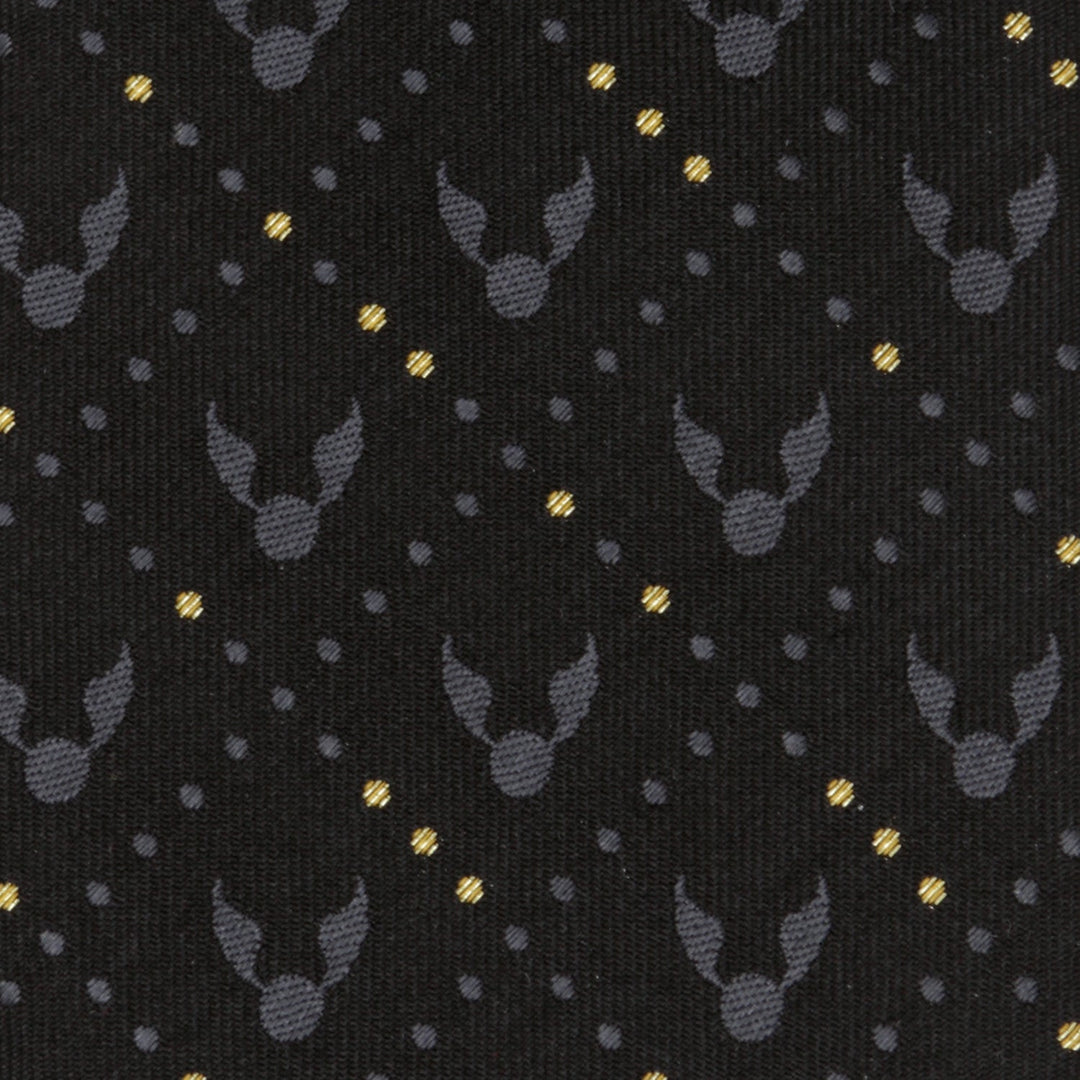 Harry Potter Golden Snitch Black Silk Men’s Tie in black and gold featuring a repeating pattern of gray winged spheres and diagonal rows of gold dots.