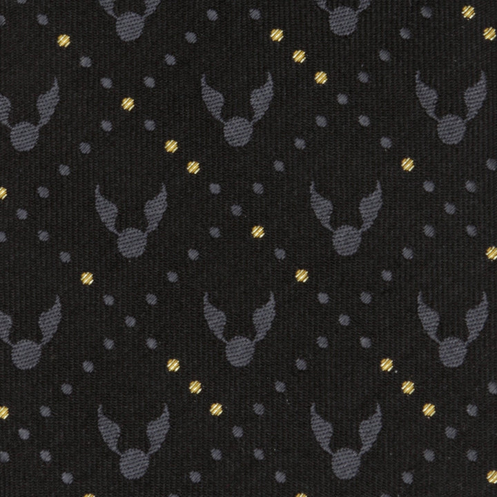 Harry Potter Golden Snitch Black Silk Men’s Tie in black and gold featuring a repeating pattern of gray winged spheres and diagonal rows of gold dots.