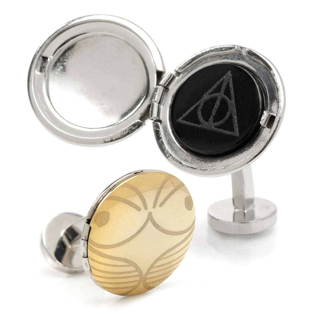 Harry Potter Golden Snitch Hidden Deathly Hallows Locket Cufflinks featuring a gold-toned Golden Snitch and a silver-toned hinged locket with the Deathly Hallows symbol on a black circular insert.