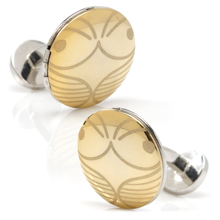 Two circular gold-toned Harry Potter Golden Snitch Hidden Deathly Hallows Locket cufflinks engraved with a stylized winged design.