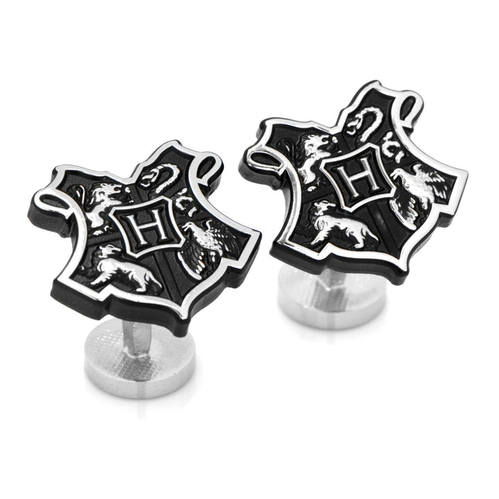 Harry Potter Hogwarts 3D Crest Cufflinks featuring a silver-toned, black-and-silver shield with an “H” in the center, surrounded by four animal emblems.