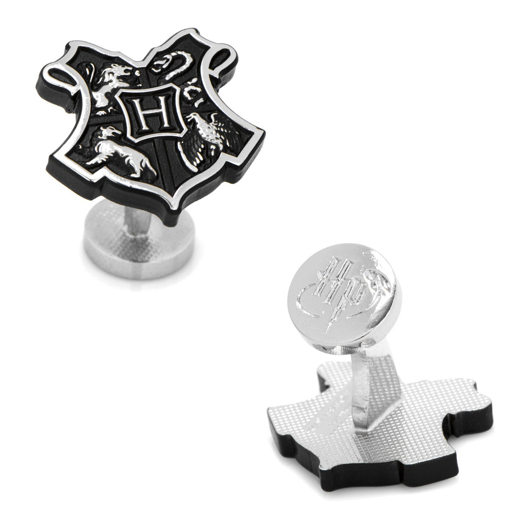 Harry Potter Hogwarts 3D Crest Cufflinks: one showing the Hogwarts crest with an “H” at the center, and the other showing a circular toggle engraved with “HP”.