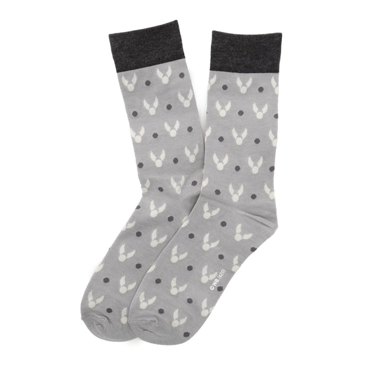 A pair of grey Harry Potter 3 Pack Sock Gift Set crew socks with a repeating pattern of white snitches and dark grey dots, featuring dark grey cuffs.