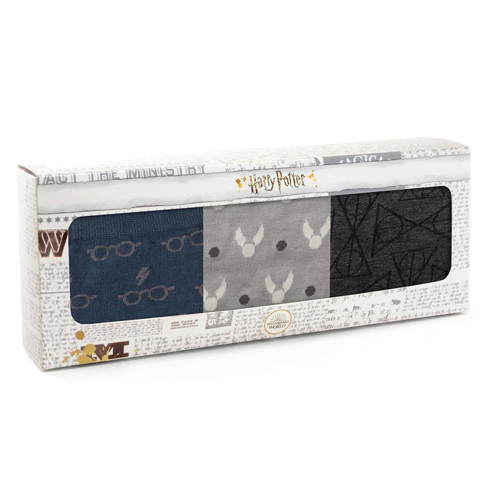A Harry Potter 3 Pack Sock Gift Set featuring three pairs of socks in a rectangular box with patterns of glasses, lightning bolts, golden snitches, and deathly hallows symbols.
