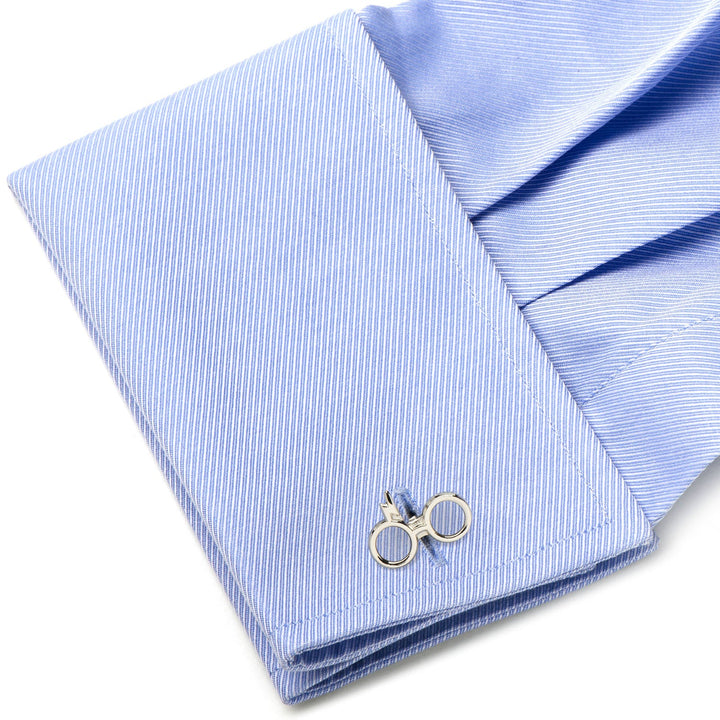 Silver Harry Potter Glasses Cufflinks with round frames attached to a light blue dress shirt cuff.