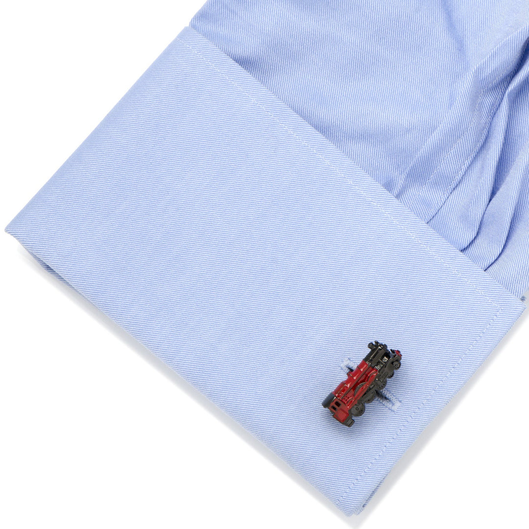 Harry Potter Hogwarts Express 3D Cufflinks in the shape of a red locomotive fastened to a light blue dress shirt cuff.