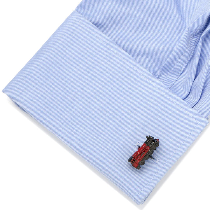 Harry Potter Hogwarts Express 3D Cufflinks in the shape of a red locomotive fastened to a light blue dress shirt cuff.