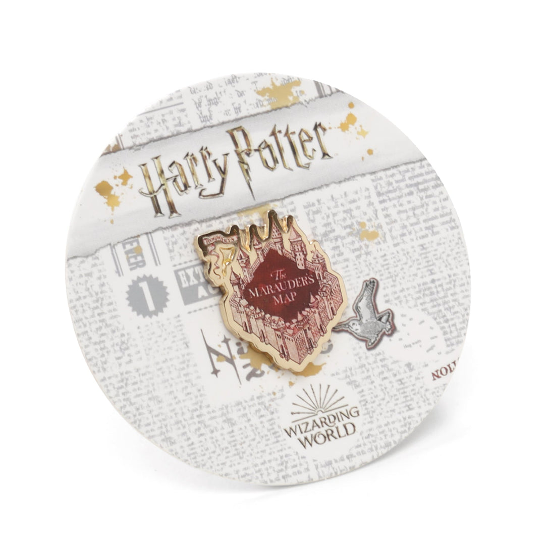 A Harry Potter Marauder’s Map Lapel Pin shaped like a castle, featuring the text “The Marauder’s Map” and a bird icon, displayed on a circular card with newspaper print and the Wizarding World logo.