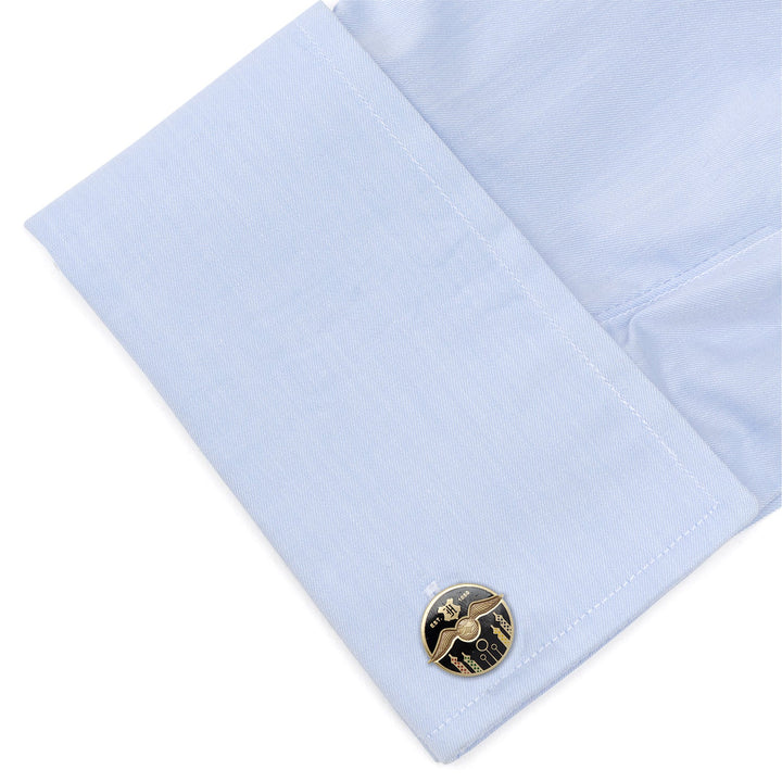 Harry Potter Quidditch Field Cufflinks featuring a round, winged golden snitch design attached to a light blue dress shirt cuff.