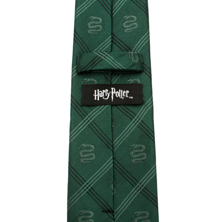 Harry Potter Slytherin Plaid Tie in green with a diagonal pattern of repeating snake emblems and a black brand label on the back.