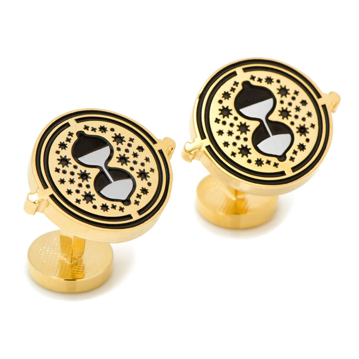 Harry Potter Hermione’s Time Turner Cufflinks shaped like gold hourglasses surrounded by black star cutouts.
