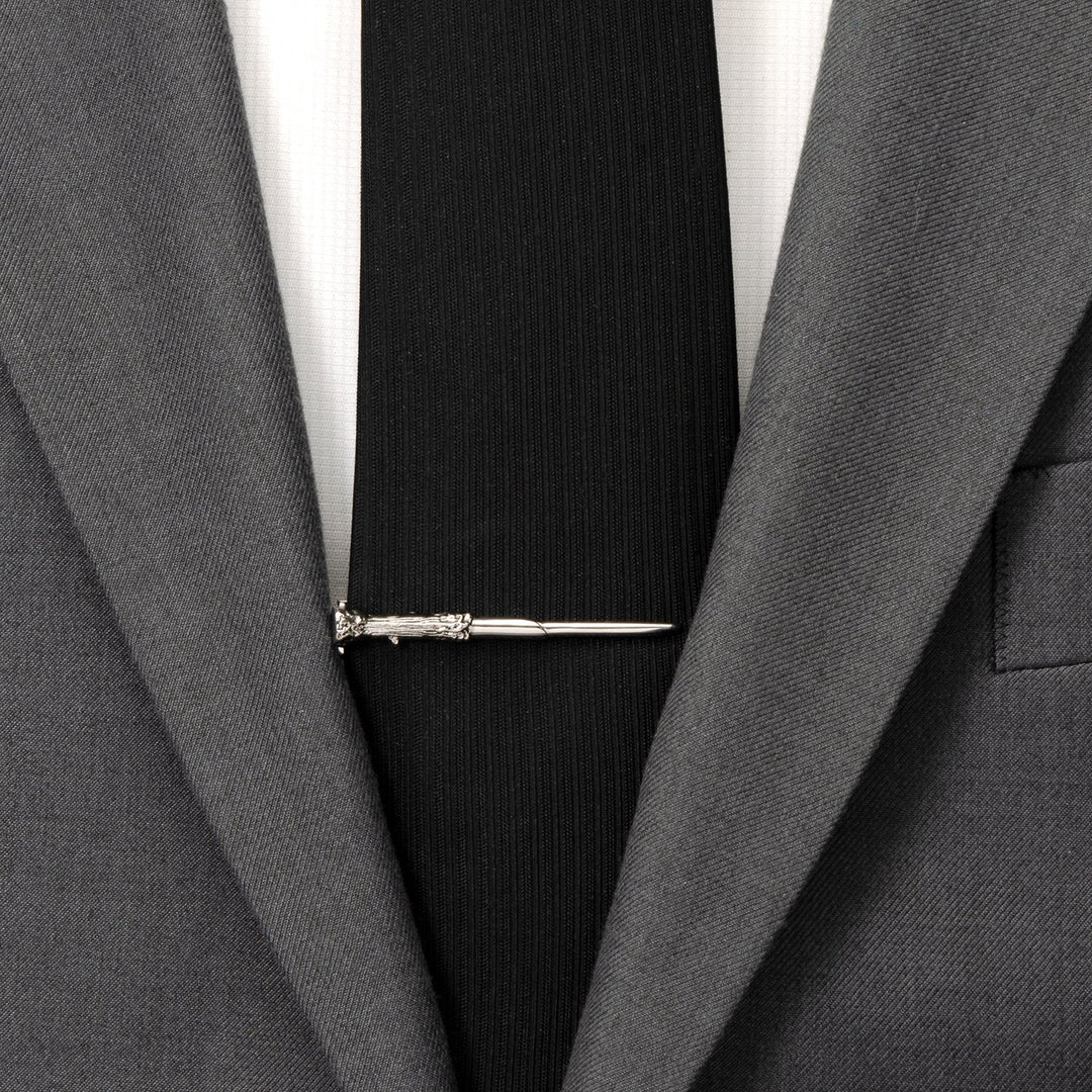 Silver-toned Harry Potter Wand Tie Clip worn on a black necktie and gray suit jacket.