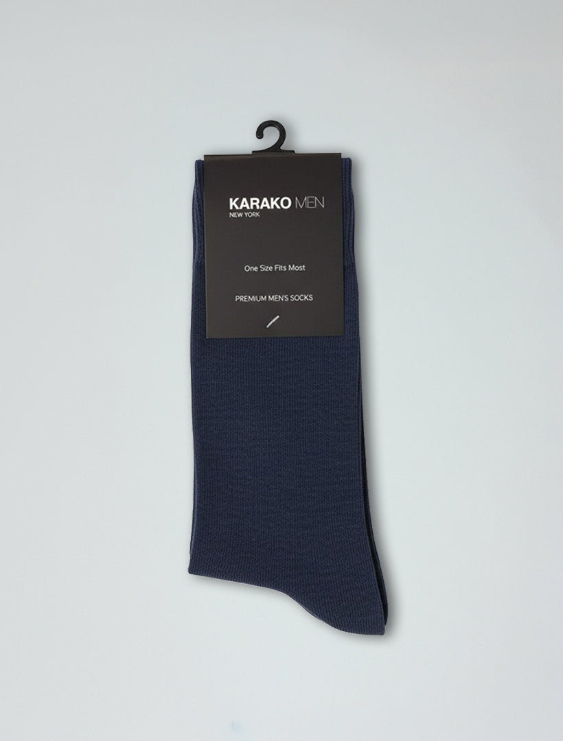 A pair of Karako Men Navy Basic Dress Socks for men, on a hanger, labeled "Karako Men New York, One Size Fits Most," with ribbed stay-up cuffs for added comfort.