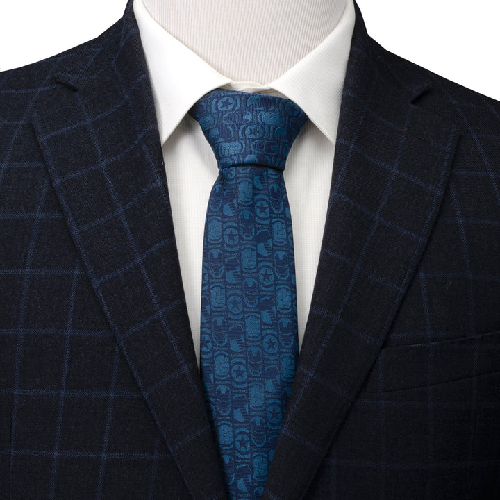 Marvel Avengers Men’s Blue Tie patterned with small repeating character masks and logos, worn with a white dress shirt and dark plaid blazer.