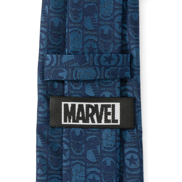 Marvel Avengers Men’s Blue Tie in a blue silk blend featuring a tonal pattern of Avengers character masks and logos, with a Cufflinks.com brand label stitched to the back.