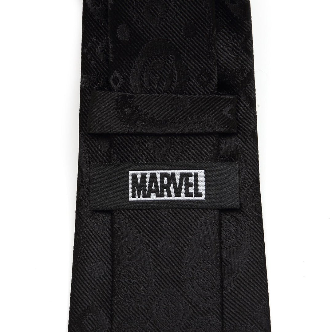 Back of a black Marvel Avengers Paisley Icons Print Black Tie with a woven paisley pattern and a label that reads “MARVEL.”