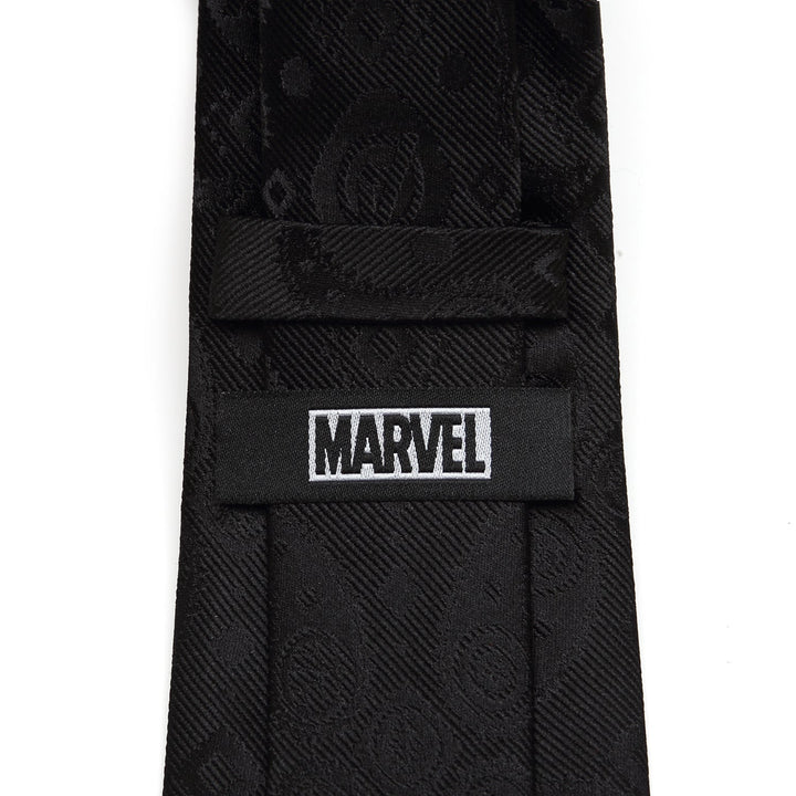 Back of a black Marvel Avengers Paisley Icons Print Black Tie with a woven paisley pattern and a label that reads “MARVEL.”