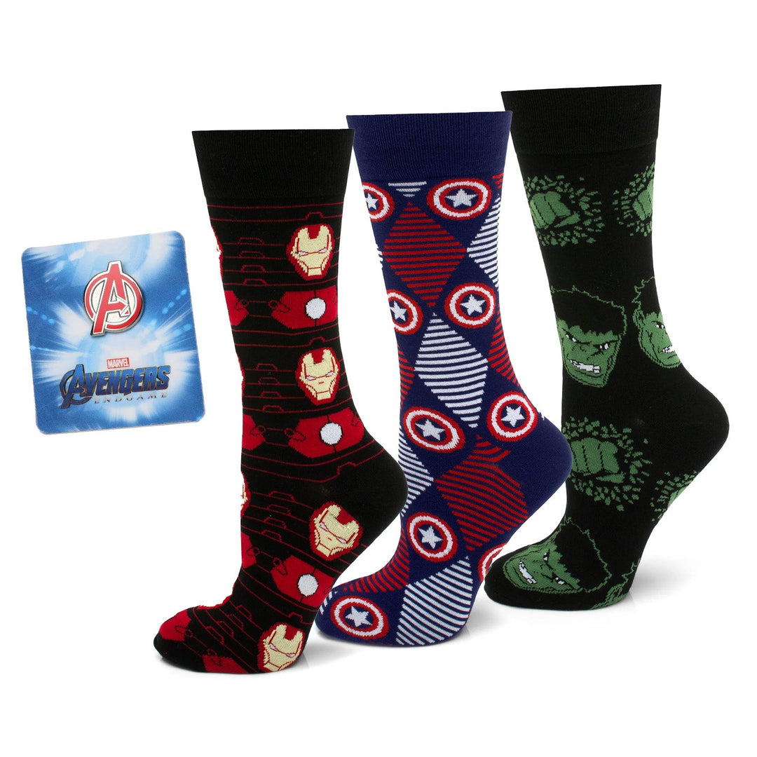Marvel Avengers Favorites 3 Pair Socks and Lapel Pin Gift Set featuring three pairs of socks with Iron Man, Captain America’s shield, and the Hulk, plus a square Avengers logo lapel pin.