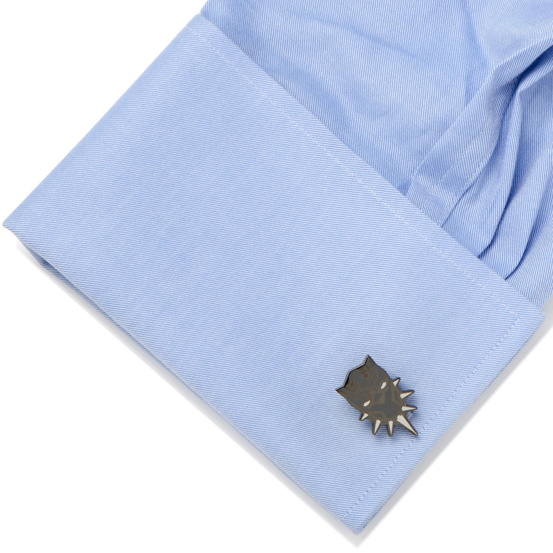 Marvel Black Panther Cufflinks shaped like a superhero mask fastened to a light blue dress shirt cuff.