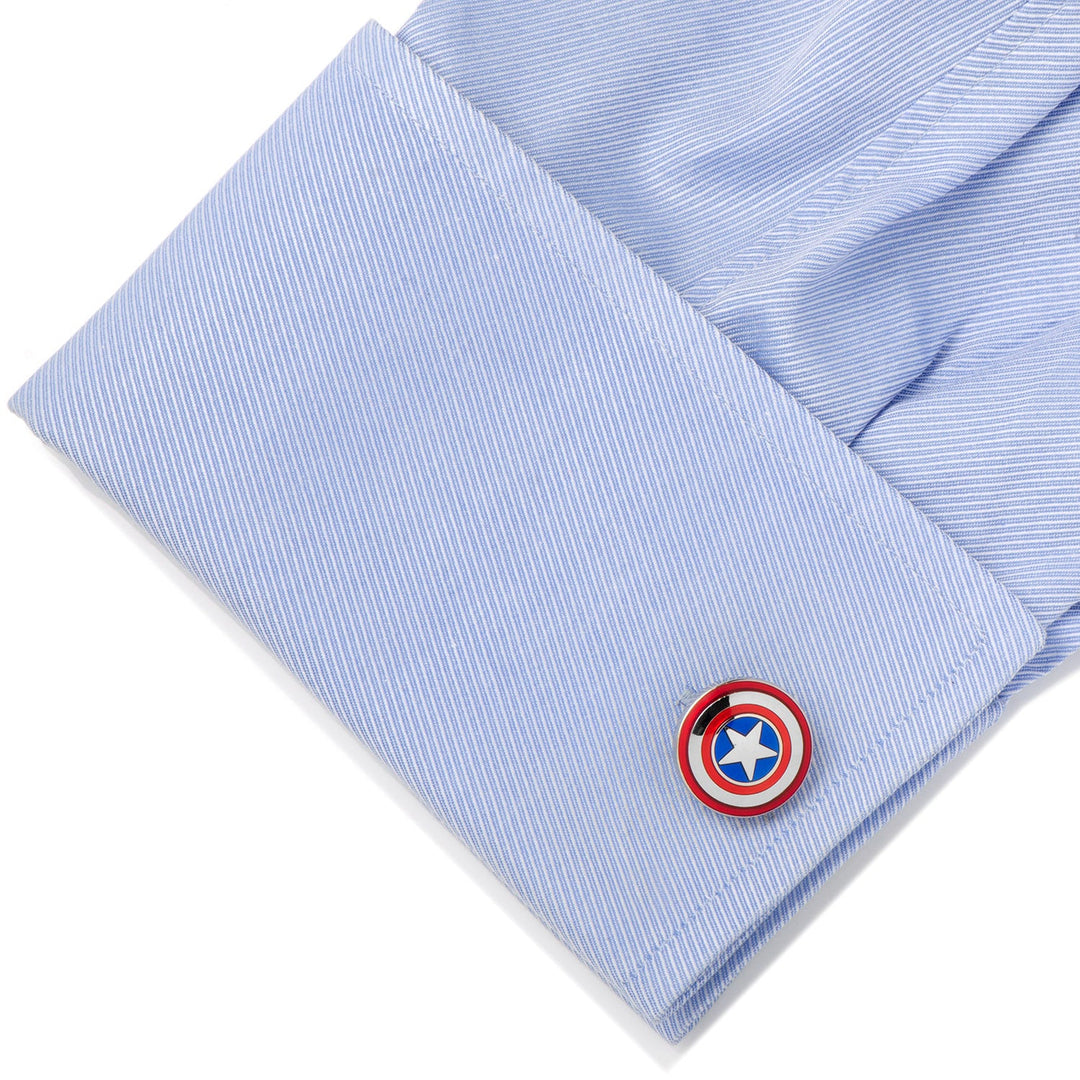 Marvel Avengers Captain America Shield Cufflinks featuring a circular red, white, and blue star emblem attached to a light blue dress shirt cuff.
