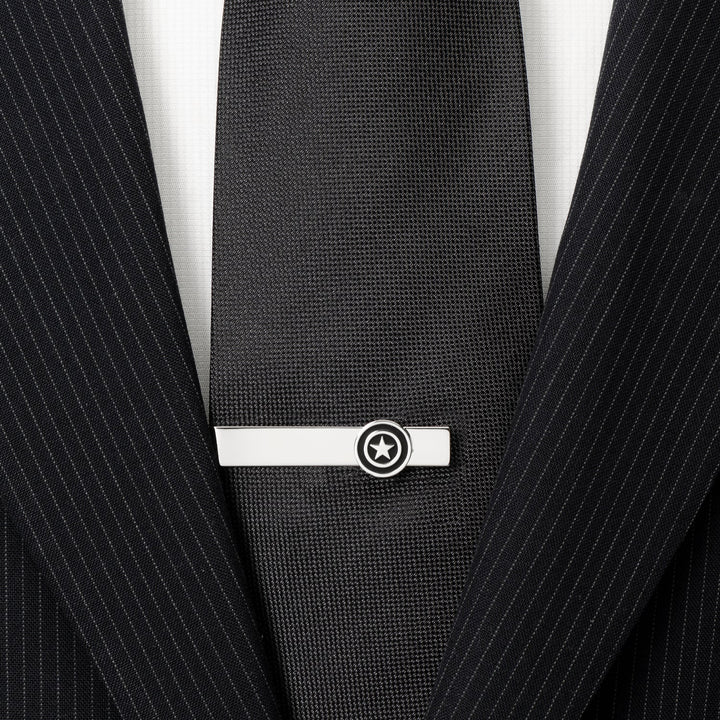 Marvel Captain America Silver Tie Bar featuring a circular shield emblem with a star, fastened to a black tie and suit jacket.