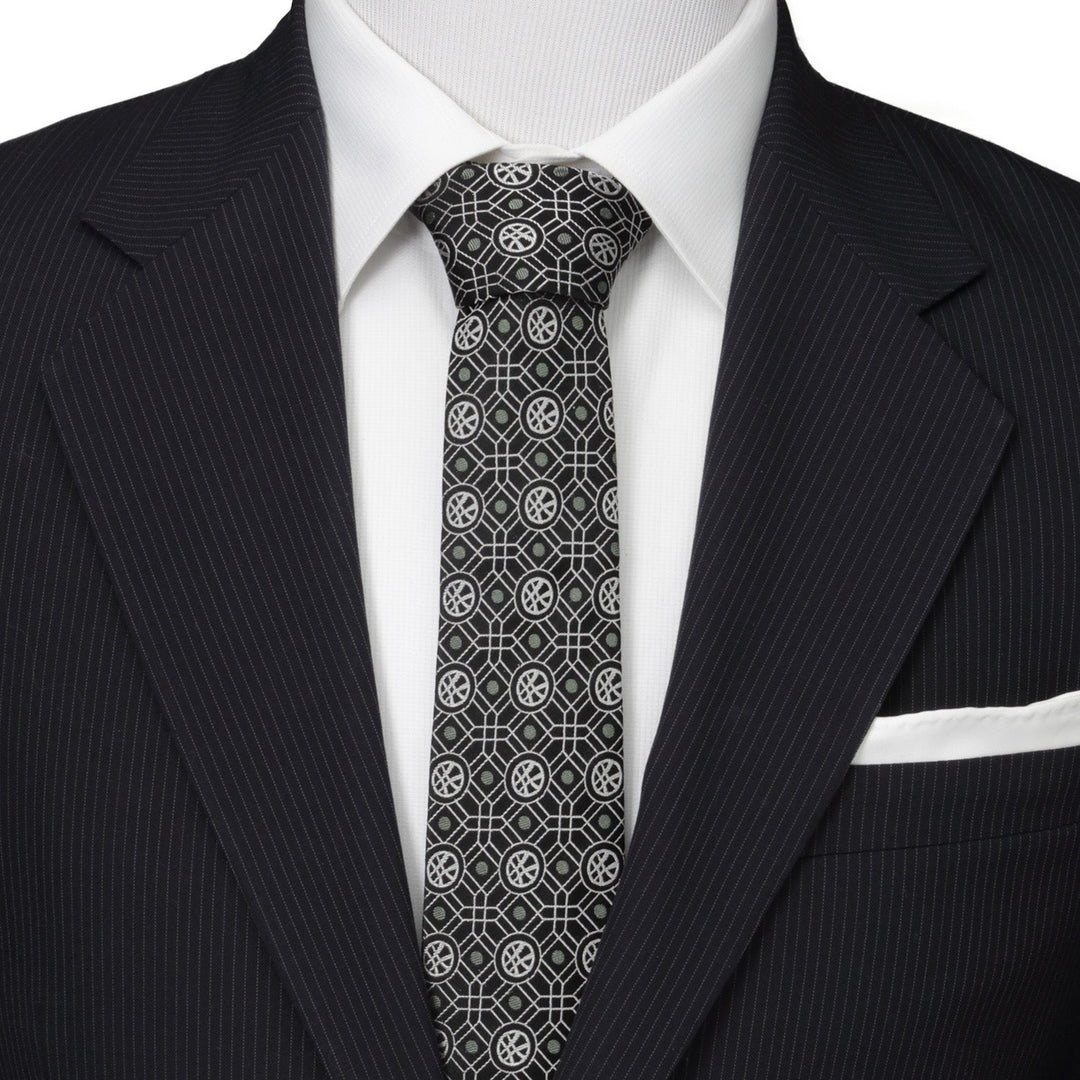 Marvel Doctor Strange Men’s Black Tie featuring a repeating gray geometric pattern of circles with crossed lines, worn with a white shirt and a pinstripe suit jacket.