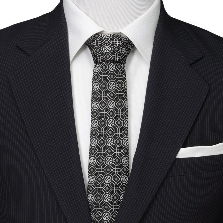 Marvel Doctor Strange Men’s Black Tie featuring a repeating gray geometric pattern of circles with crossed lines, worn with a white shirt and a pinstripe suit jacket.