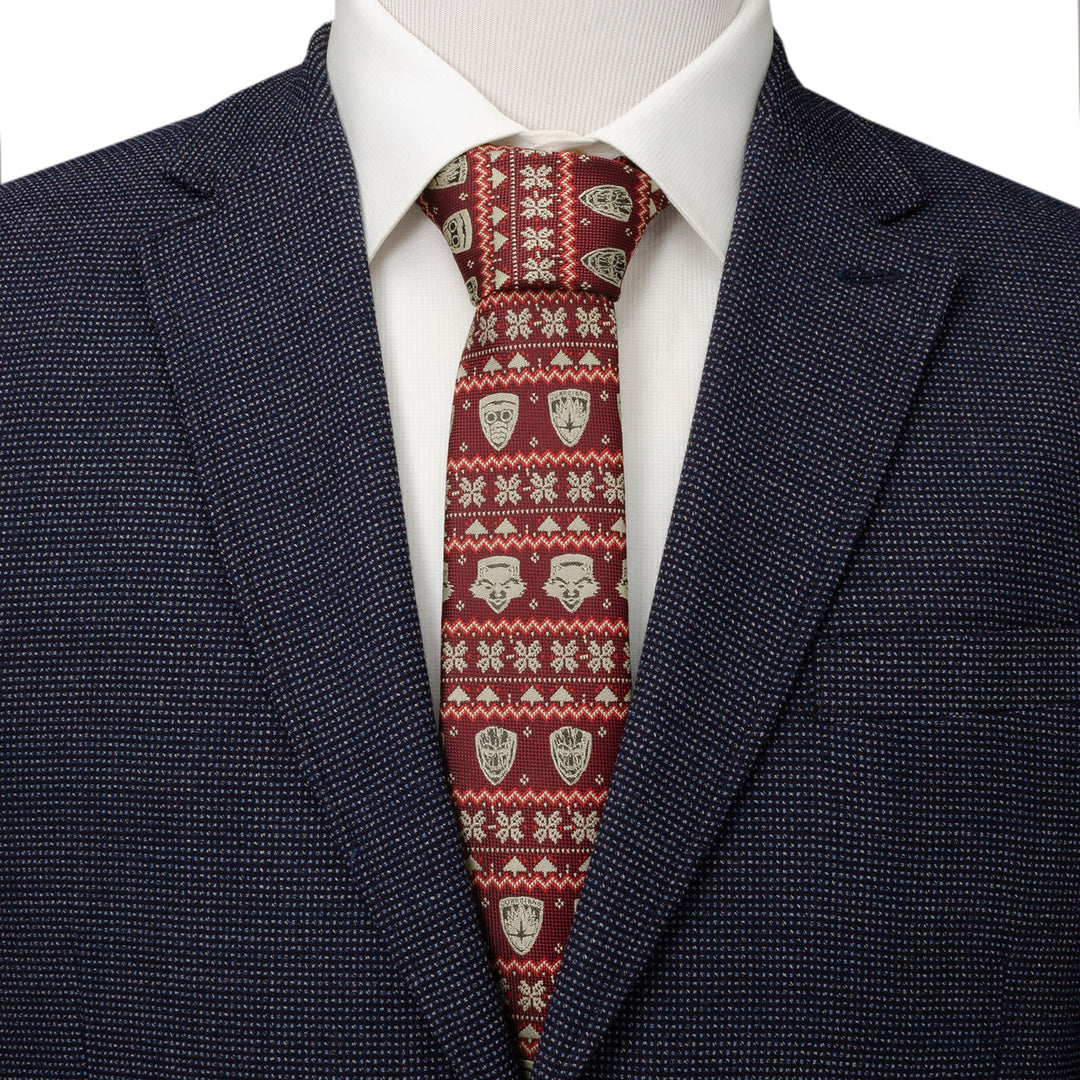 A Marvel Guardians of the Galaxy Fair Isle Red Men’s Tie featuring Star-Lord masks and geometric snowflakes, worn with a white shirt and dark blue blazer.