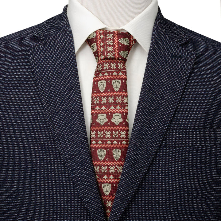 A Marvel Guardians of the Galaxy Fair Isle Red Men’s Tie featuring Star-Lord masks and geometric snowflakes, worn with a white shirt and dark blue blazer.