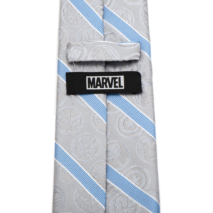 Marvel Comics Gray and Blue Stripe Men’s Tie in gray silk featuring light blue diagonal stripes, a subtle Marvel character pattern, and a black logo tag on the back.