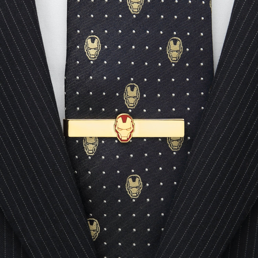 Marvel Gold Plated Iron Man Tie Bar worn over a dark patterned tie and pinstripe suit jacket.